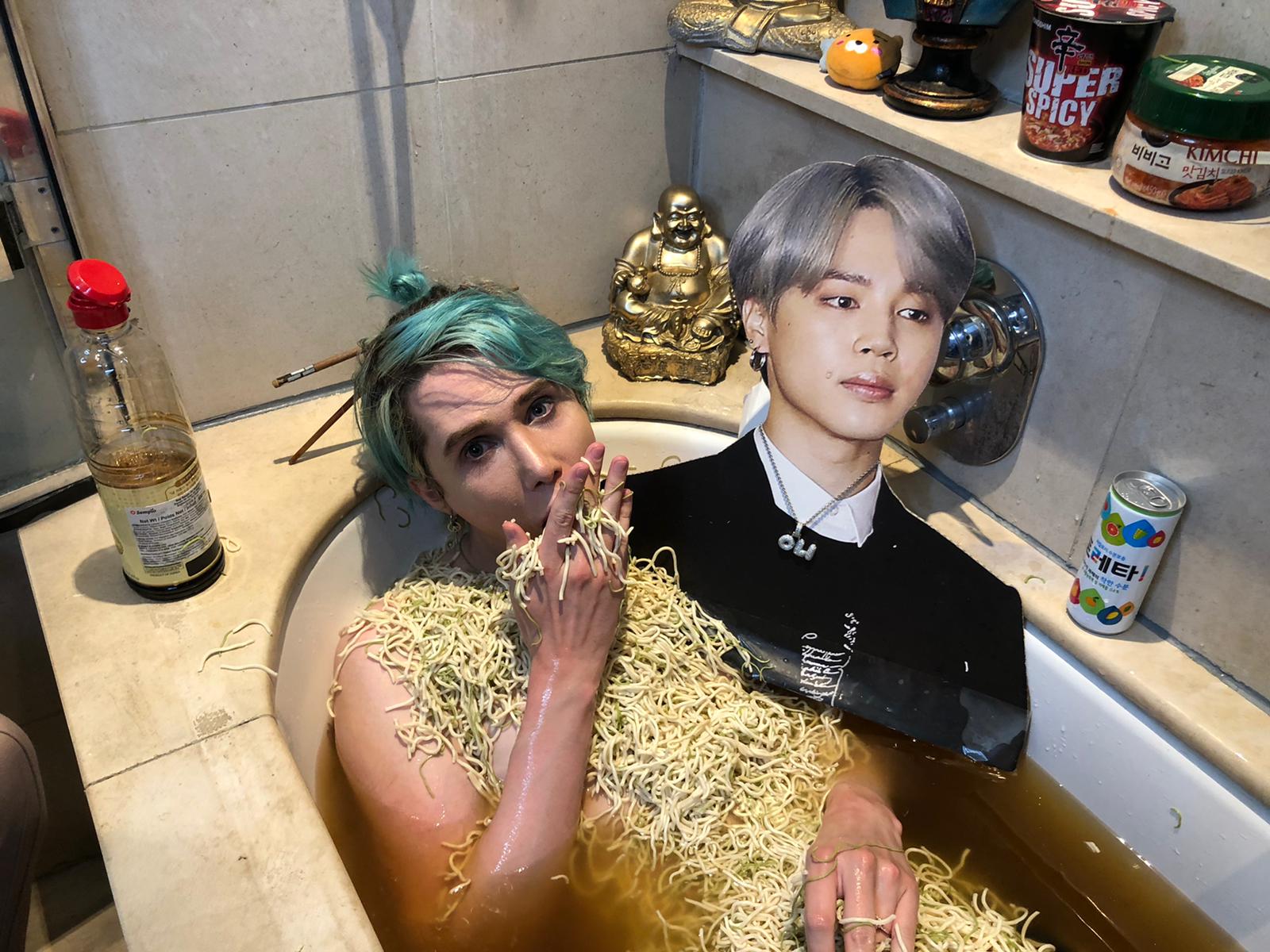 BTS Superfan Oli London Bathes in Noodles during 'Lockdown Honeymoon' with cardboard 'husband